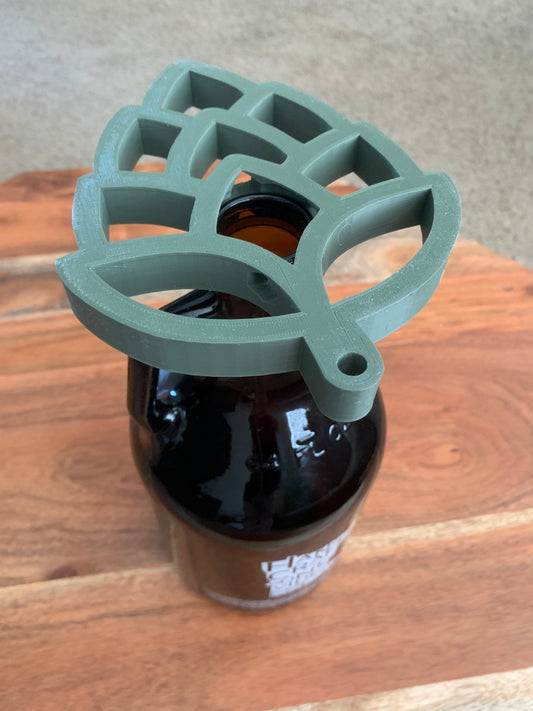 Close-up of the artistic hop-shaped design on a growler drying stand