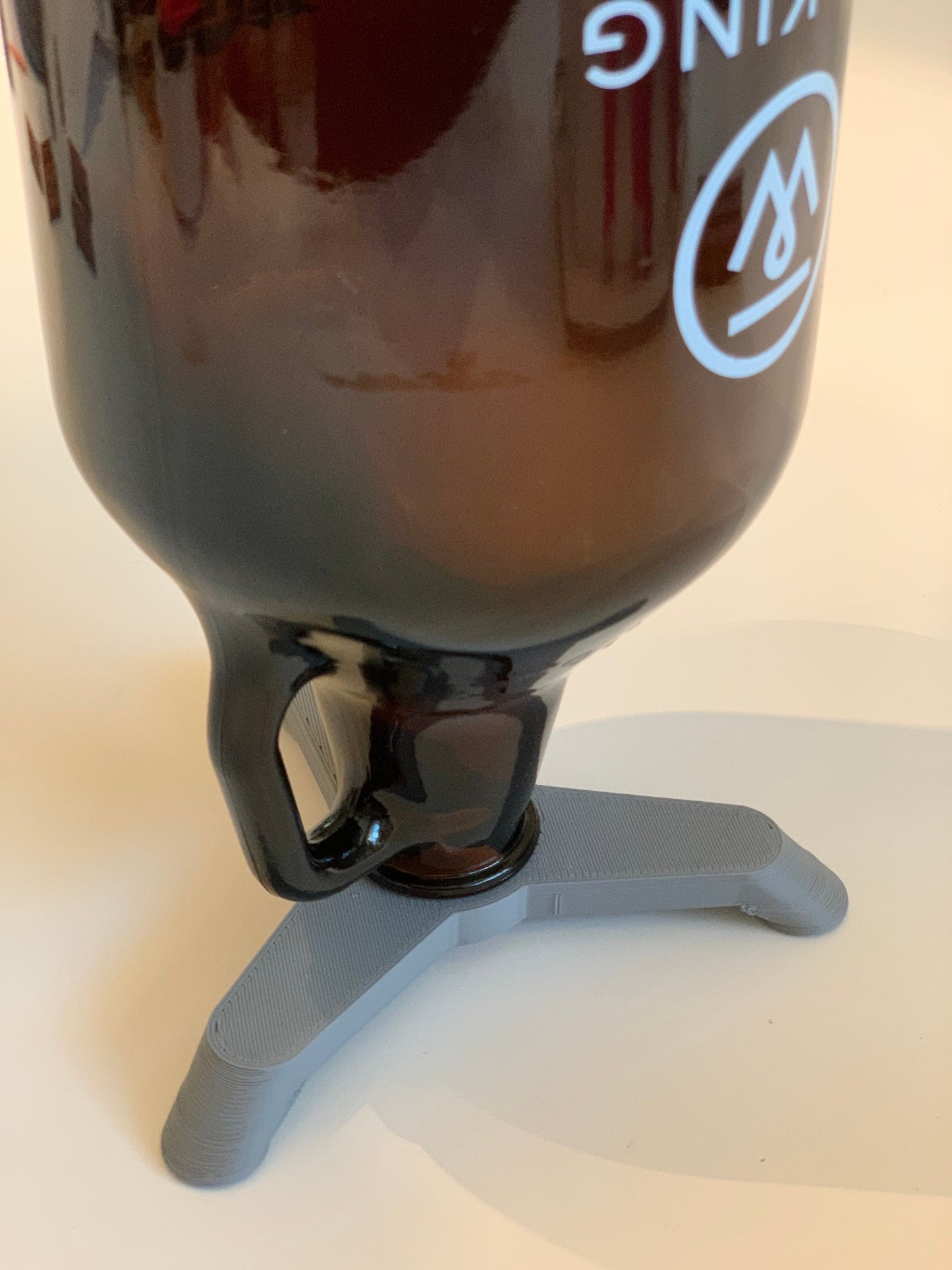 64 oz Beer Growler Drying Stand holding an upside-down growler