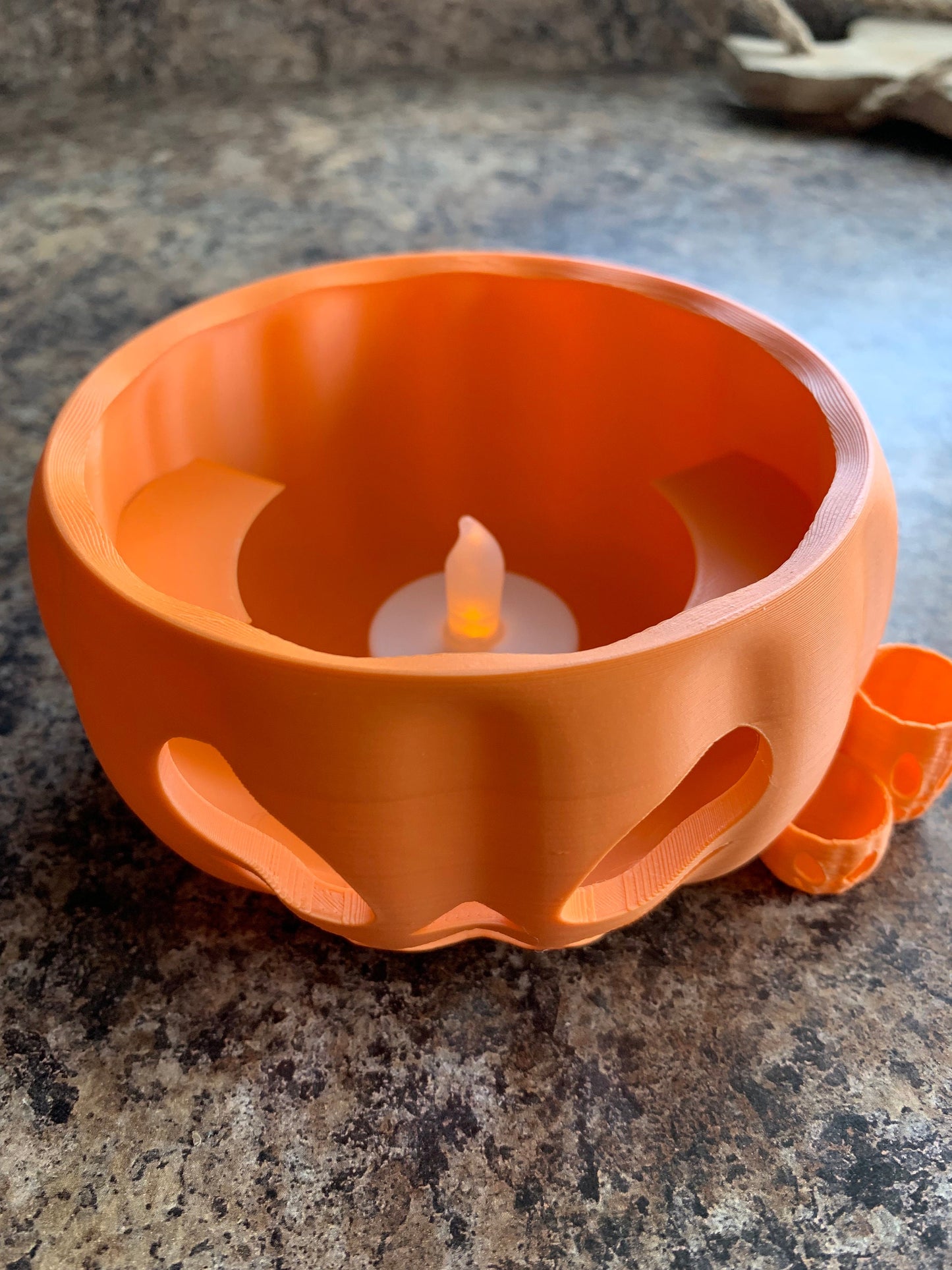 Close-up view of durable plastic Pumpkin Party Cup Holder designed for 14, 16, and 18 oz cups.