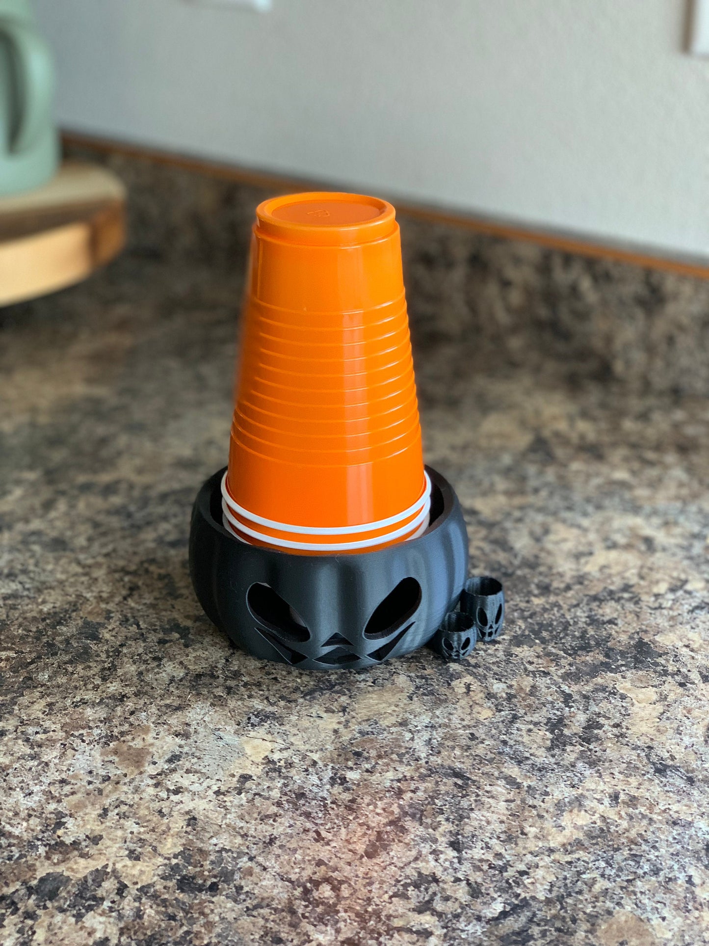 Detailed view of the Pumpkin Party Cup Holder highlighting its sturdy build and functional design for party tableware decor.