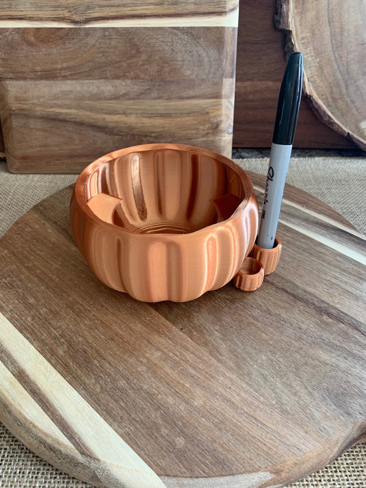 Front view of handcrafted copper pumpkin party cup holder with integrated marker slot and warm copper finish.
